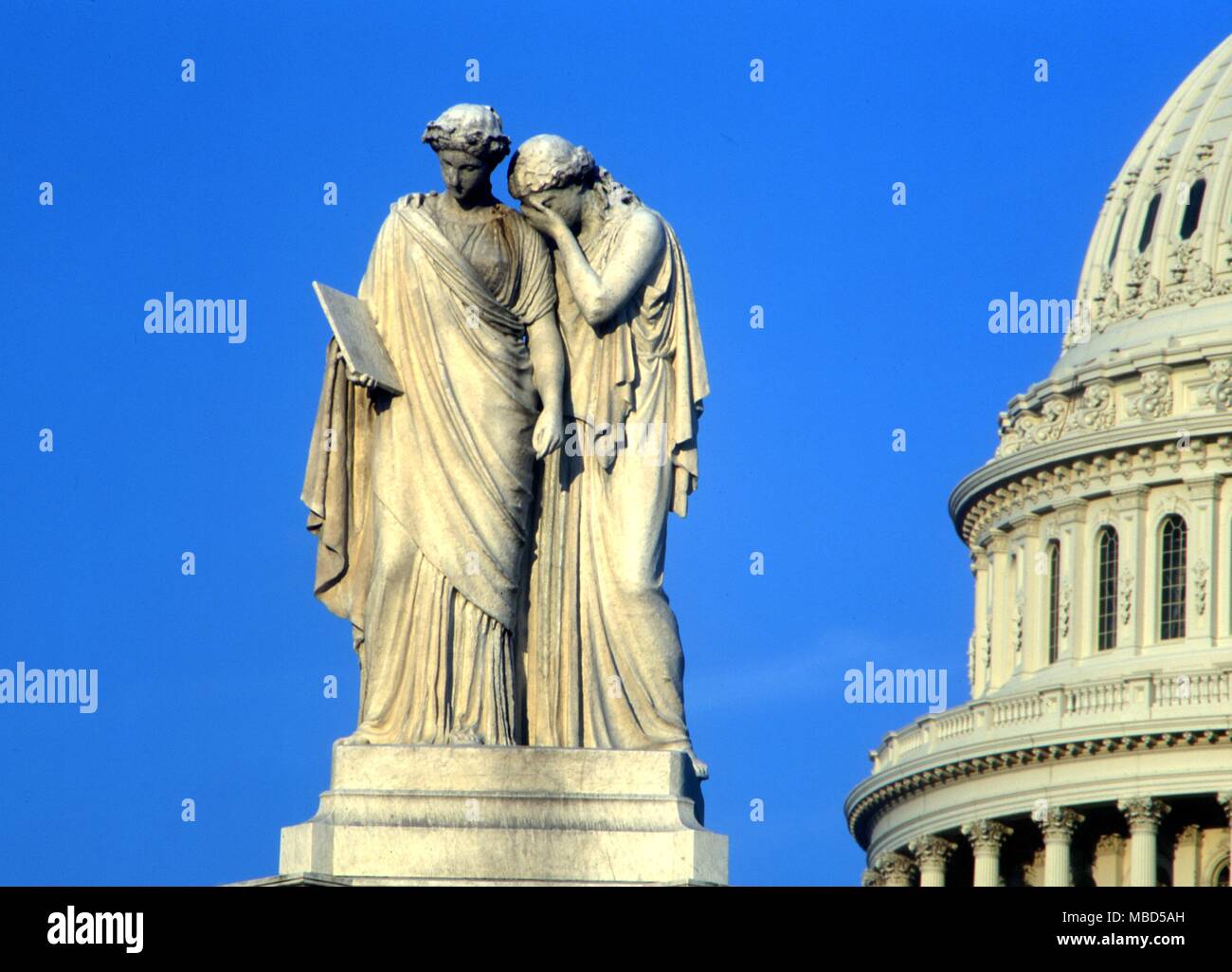 Symbols - America and History The Peace Monument (1877),sculpted by Franklin Simmons in marble. The two figures represent America weeping on the shoulders of History over the loss of her naval defenders during the Civil War. Washington DC Stock Photo