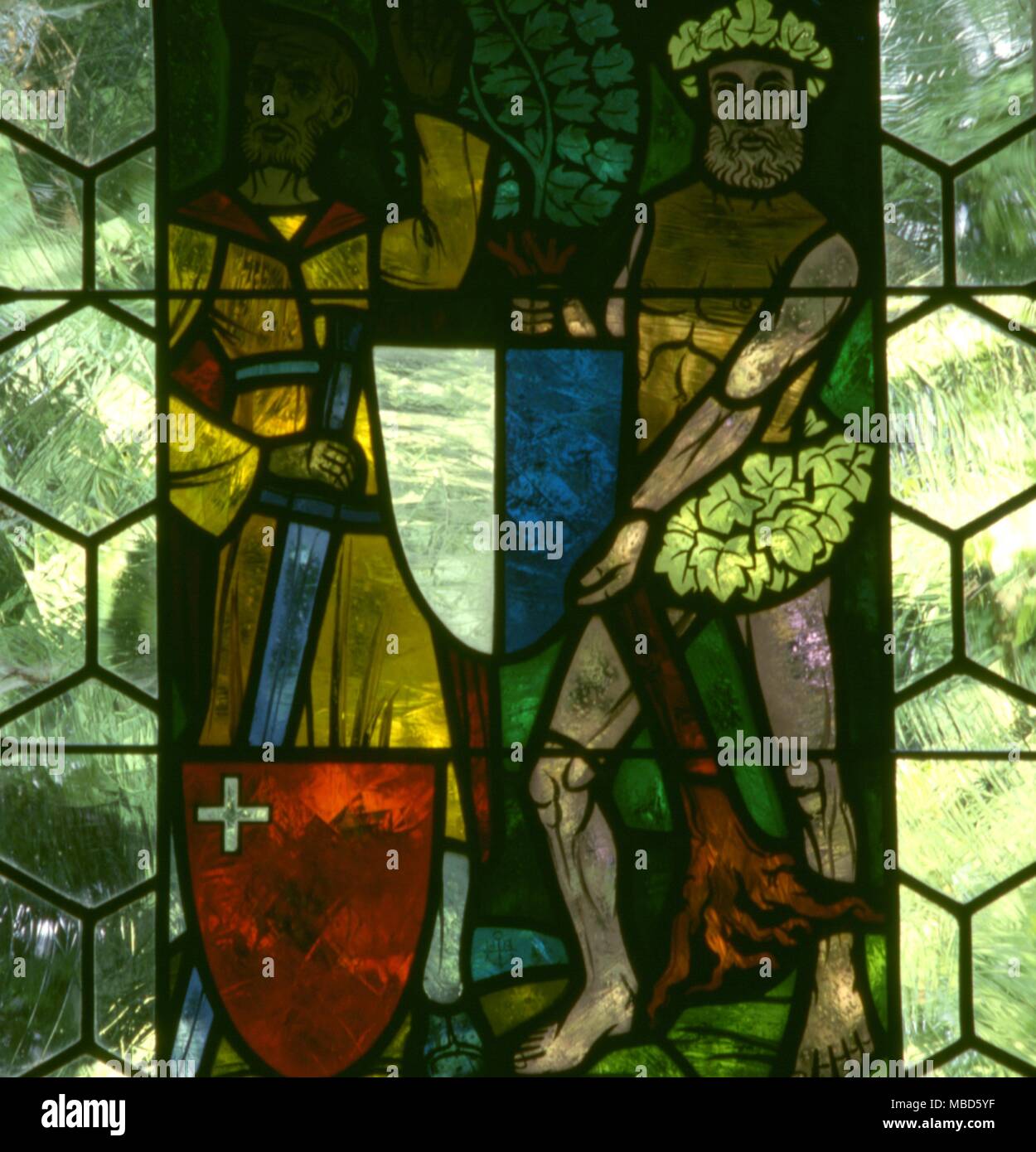 Green Man, or Woodwose. Stained glass in the William Tell Chapel at Hohergasse, Vierwaldsee, Switzerland . Stock Photo