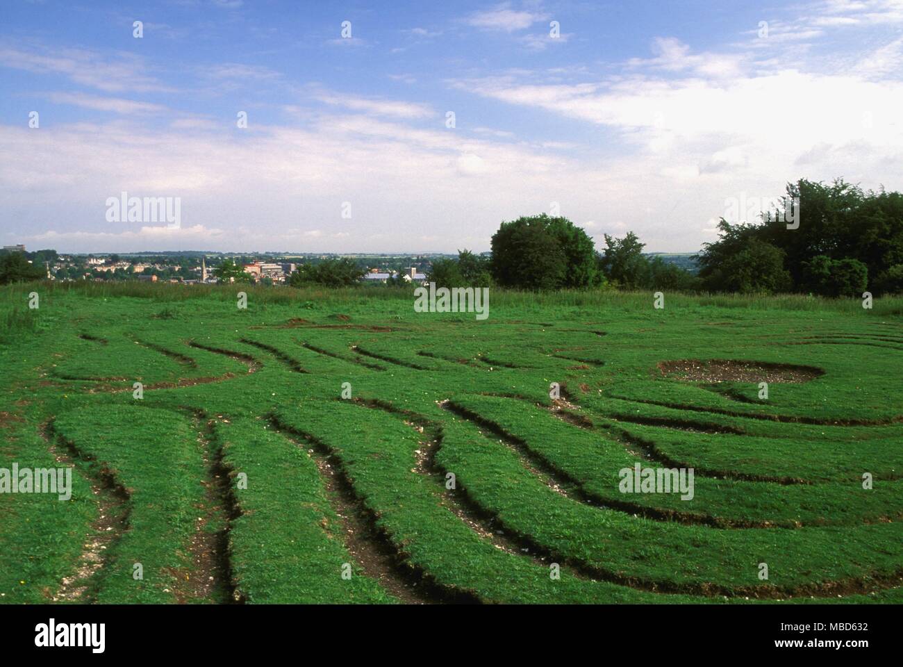 The Miz - maze, St Catherine's Hill, with Winchester Cathedral between shrubs. Photo credit : John Glover Stock Photo