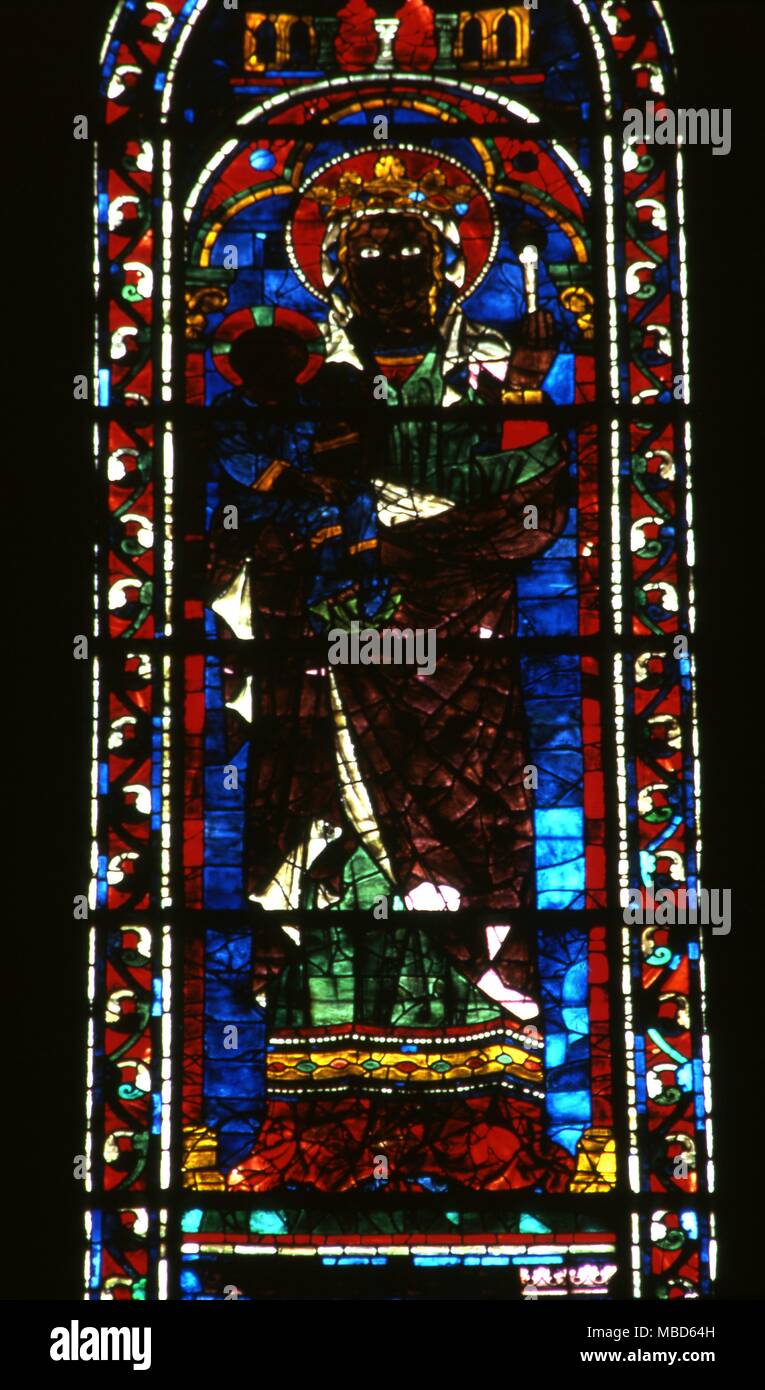 Black virgins - Chartres The so called Black Madonna stained glass in Chartres Cathedral. It is unclear whether or not the flesh on the glass is merely discoloured with age . Stock Photo