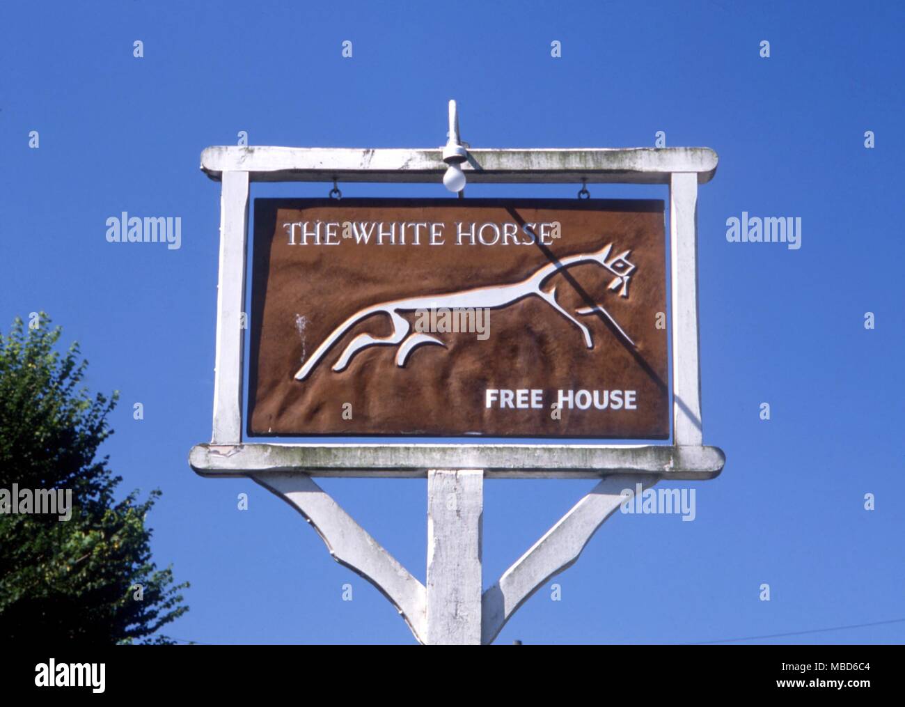 The so-called White Horse at Uffington, here represented on an inn-sign, is said to have been a dragon in its original form. Stock Photo