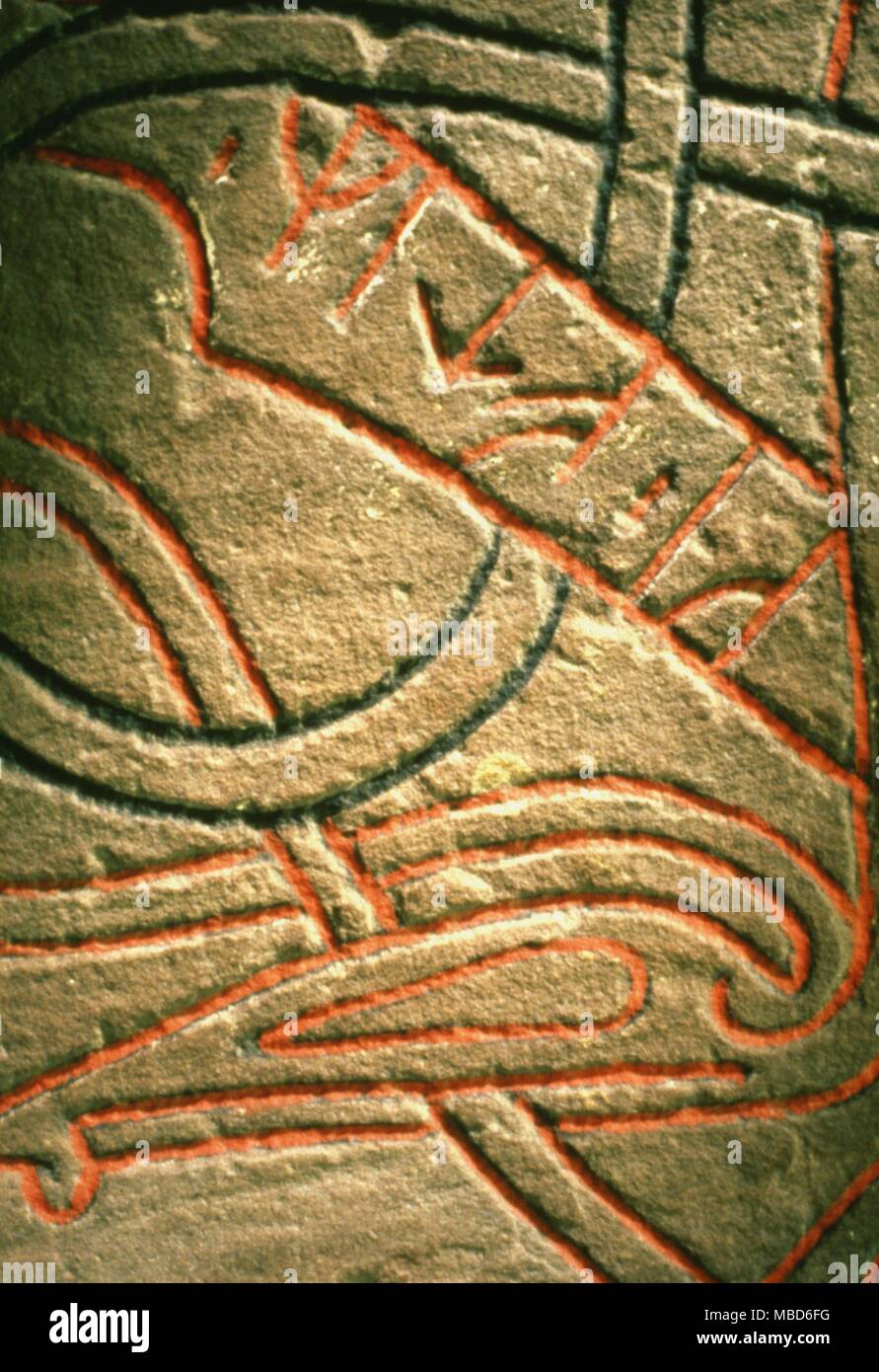 Details of runes on Scandinavian rune stone bearing interlace dragon - head patterns and numerous inscription runes. Ashmolean Museum, Oxford . Stock Photo
