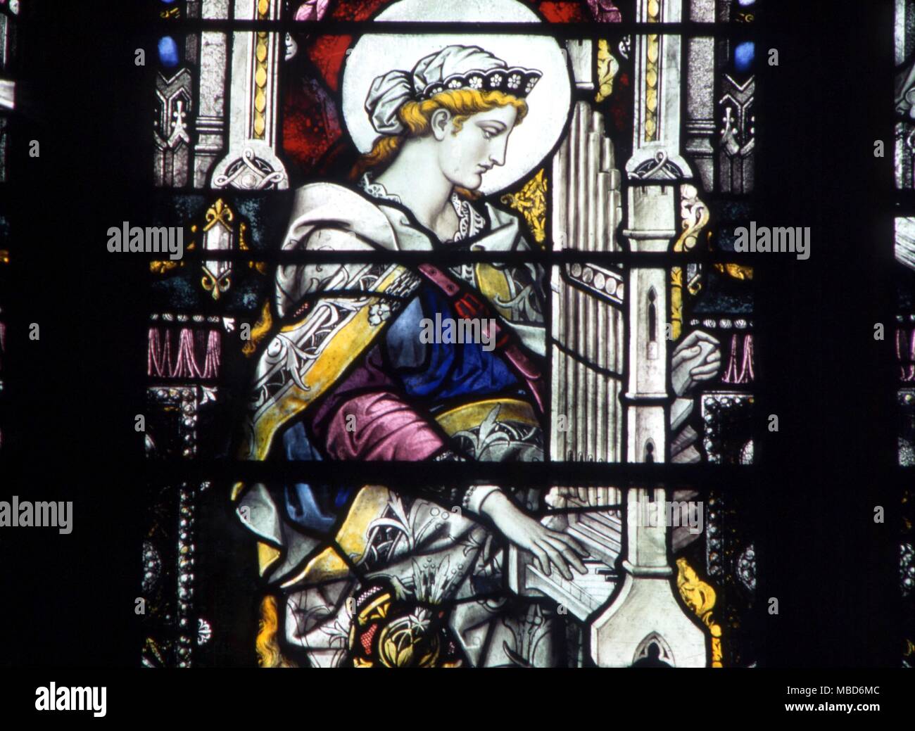 CHRISTIAN - ST CECILIA - at the organ (she is patron saint of Music ). Stained glass in the north wall of St Margaret's Church, Kings Lynn. Stock Photo
