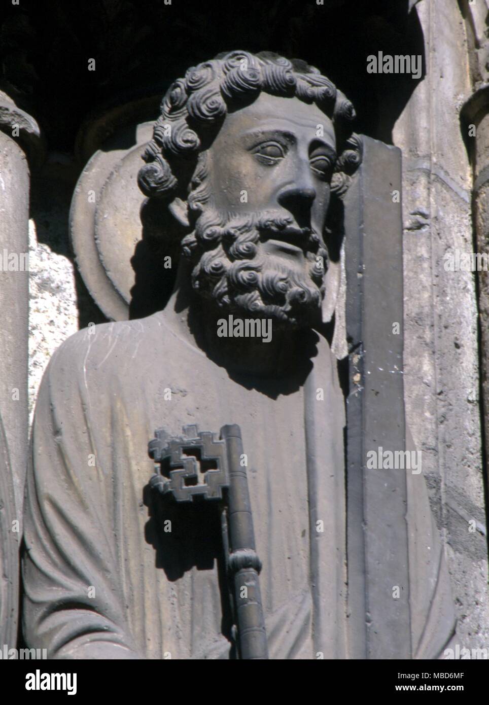 SAINTS - ST PETER - Statue of St Peter with the key attribute, on the south portal of Chartres cathedral. Stock Photo