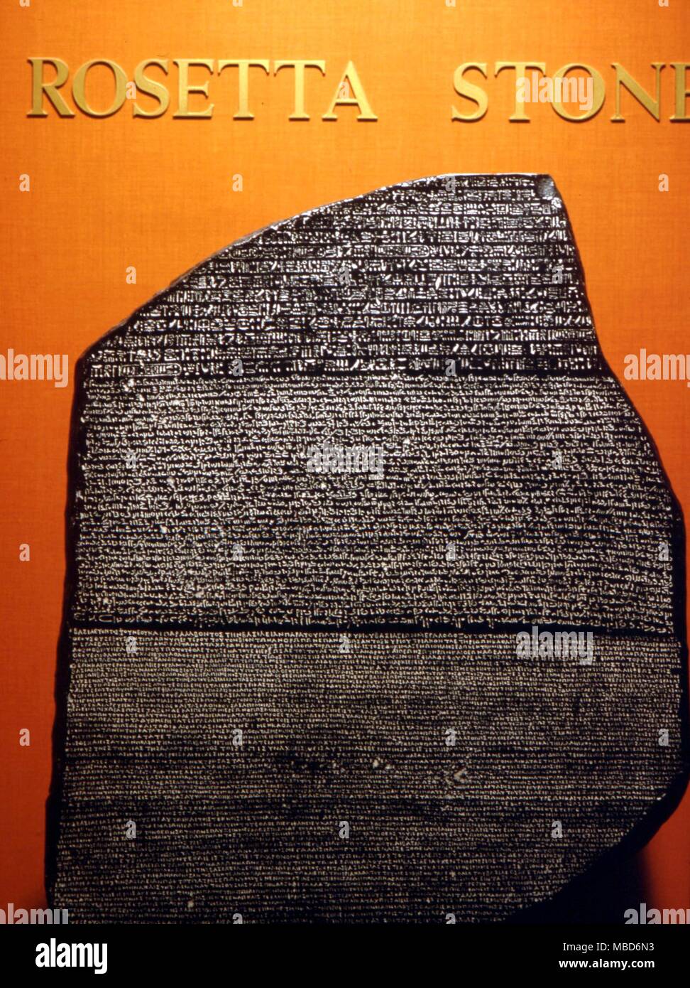 Alphabets - Rosetta Stone - The basalt slab, carved in parallel-text Greek, Egyptian demotic and hieroglyphic, which permitted Champollion decipher the ancient Egyptian hieroglyphics. Facsimile in the Egyptian Museum, San Jose 1669 Stock Photo