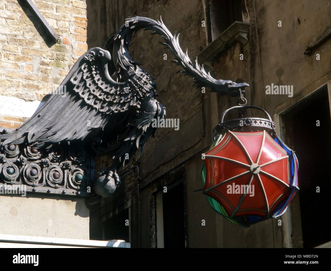 Winged dragon lantern holder in a Venice street Stock Photo