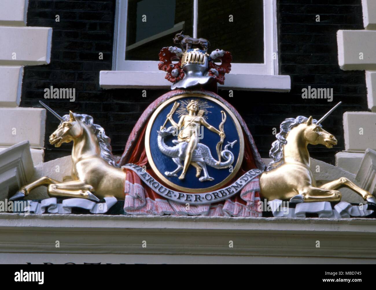 A dragon, ridden by a solar-being, on the arms of the Society of Apothecaries Stock Photo