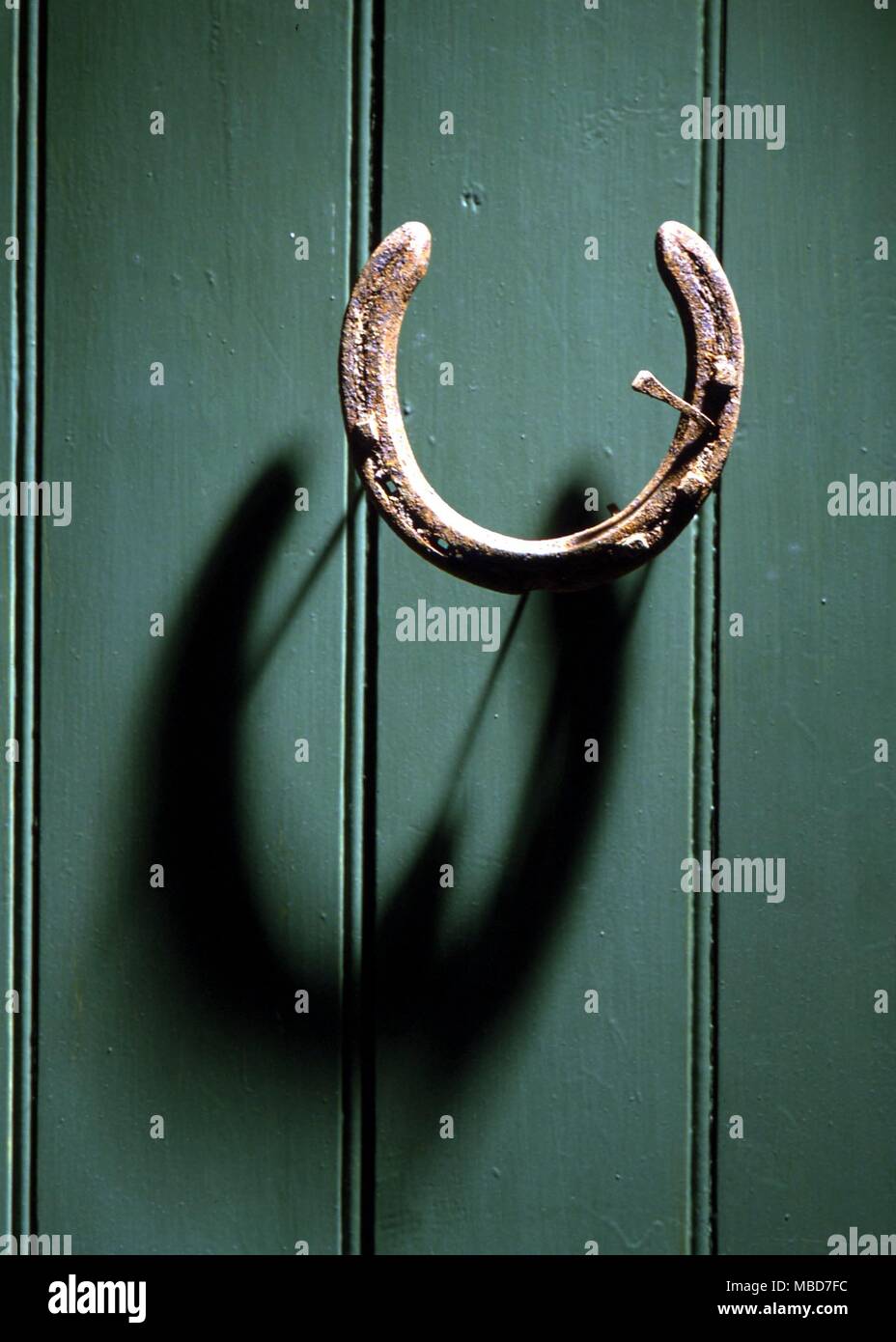 Horseshoe nailed to a door for good luck Stock Photo Alamy