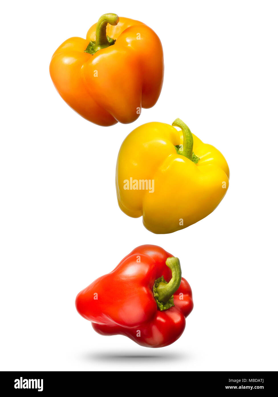 Falling bell peppers isolated on white background Stock Photo Alamy