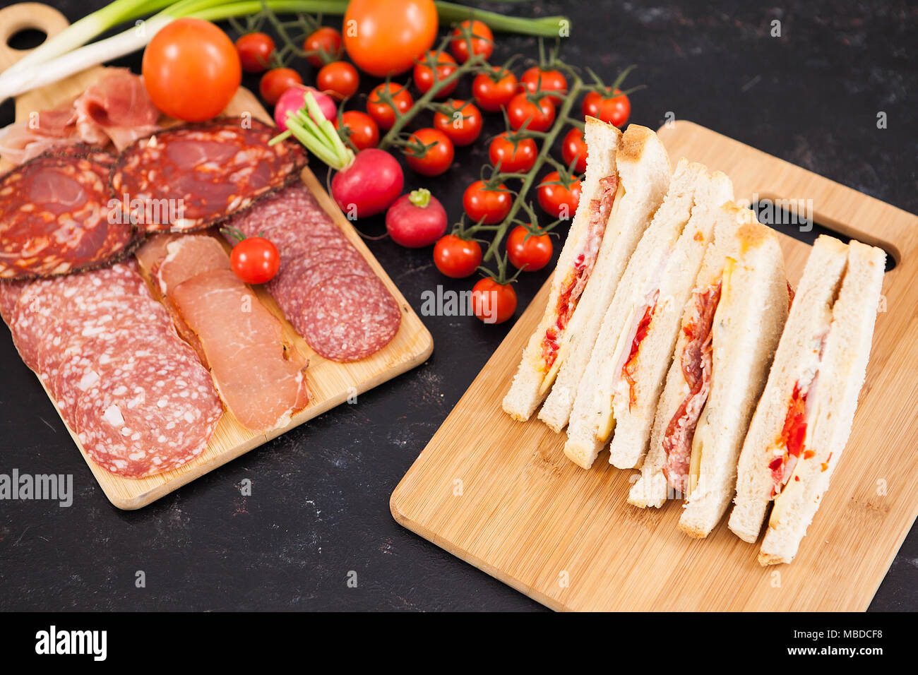 Club sandwiches with white bread and salami Stock Photo Alamy