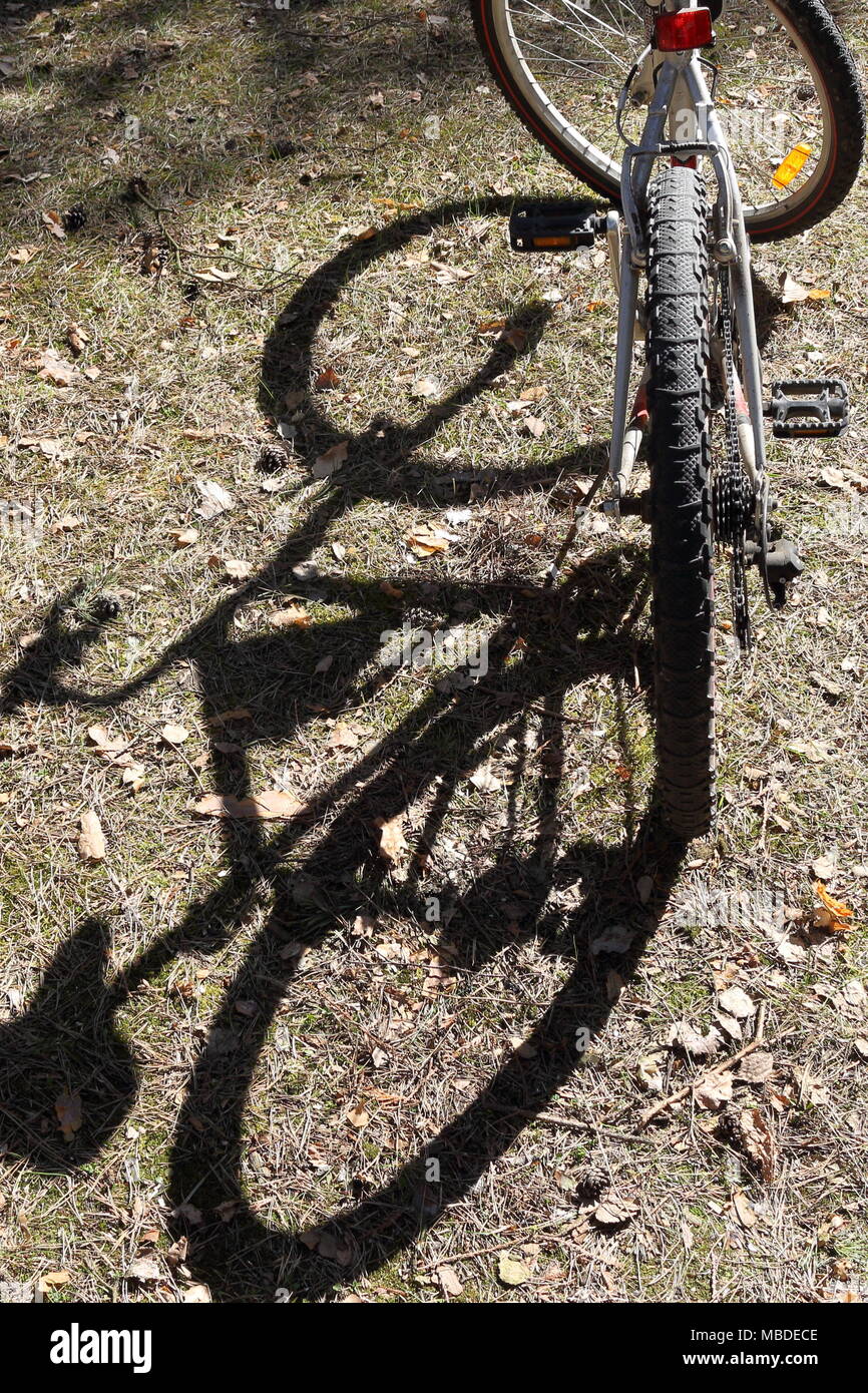 Shadow of a mountain bike on the ground Stock Photo