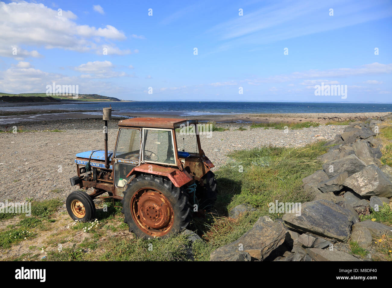 Old Leyland tractor on a sunny beach in Scotland, uk. Stock Photo