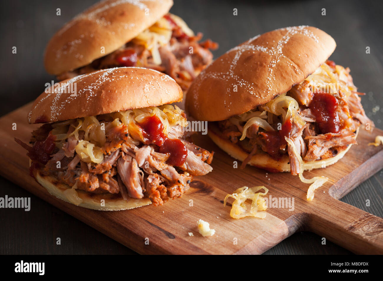 homemade pulled pork burger with caramelized onion and bbq sauce Stock