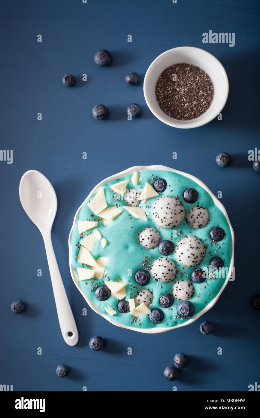 healthy blue spirulina smoothie bowl with blueberry, white chocolate,  dragon fruit, chia seed Stock Photo - Alamy