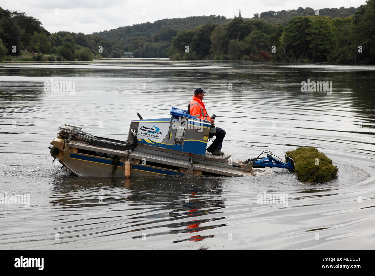 A 3 Truxor amphibious machine for collecting and gathering aquatic weeds in operation at Trentham Gardens, Stoke on Trent Stock Photo