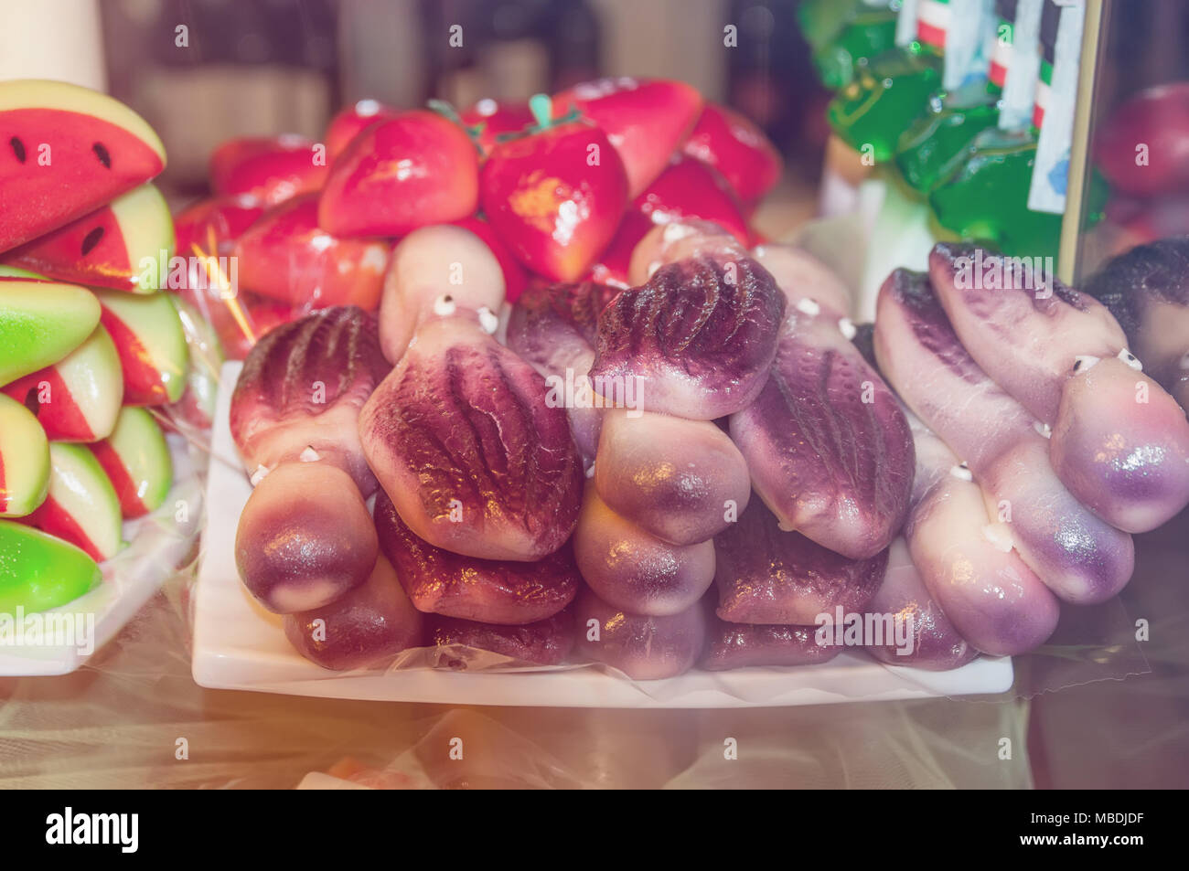 Pastry with marzipan in the form of fruit and fish. Typical Sicilian. The horizontal frame. Stock Photo