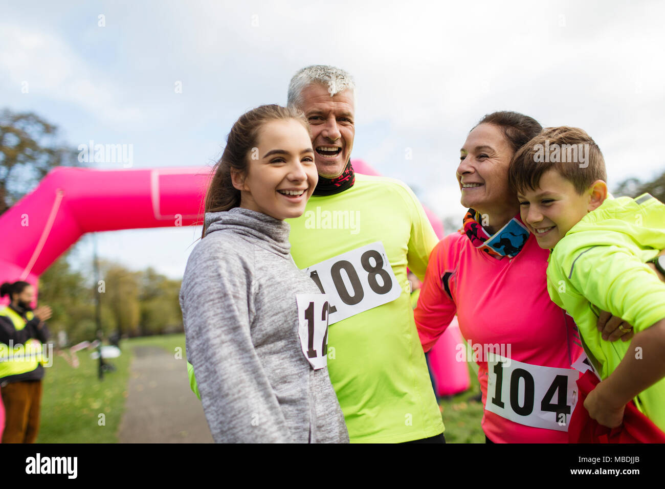 Happy family runners at charity run Stock Photo