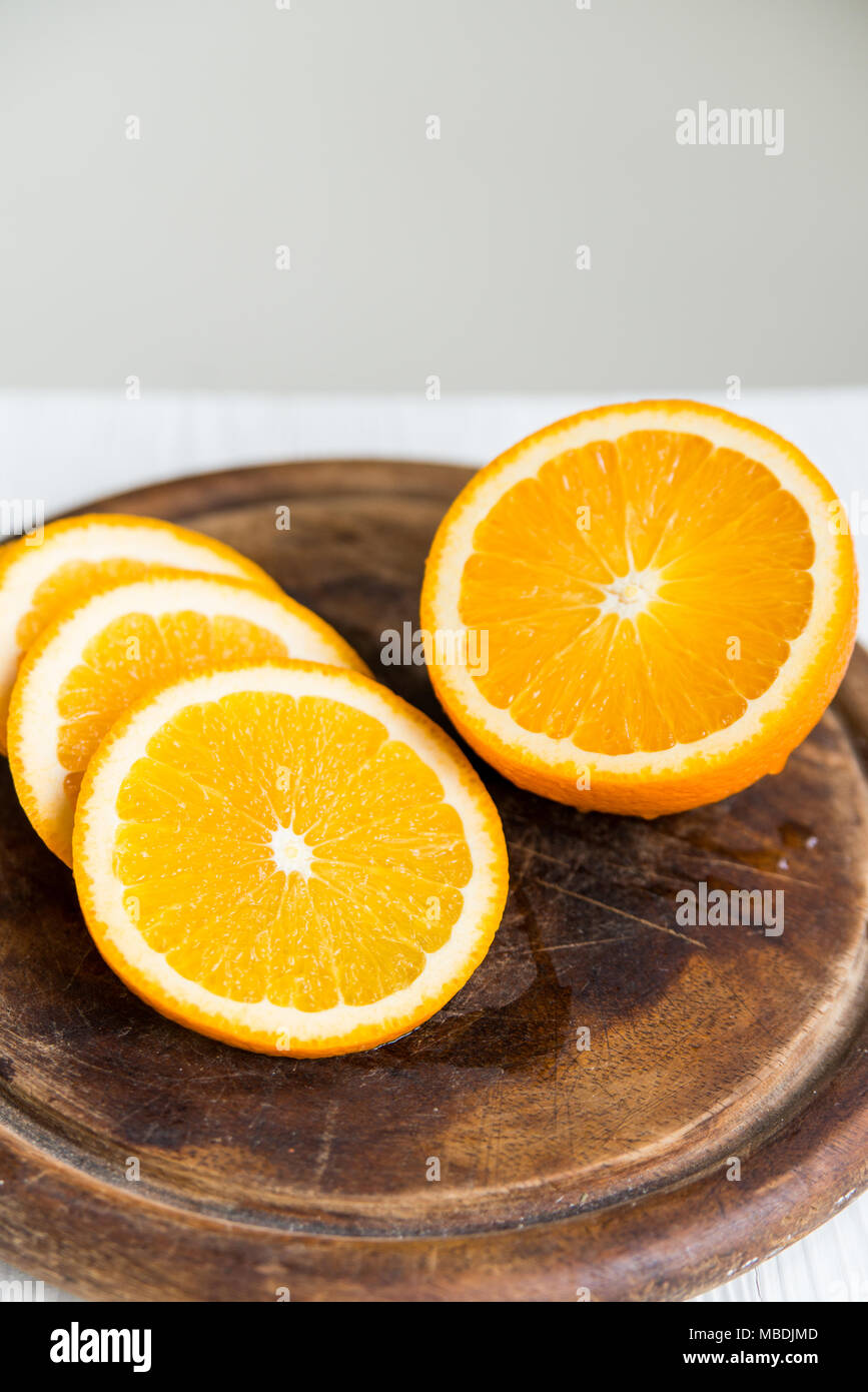 Sliced orange on cutting board close Stock Photo