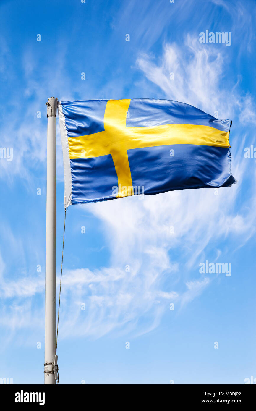 The Sweden national flag flying in the wind. Stock Photo