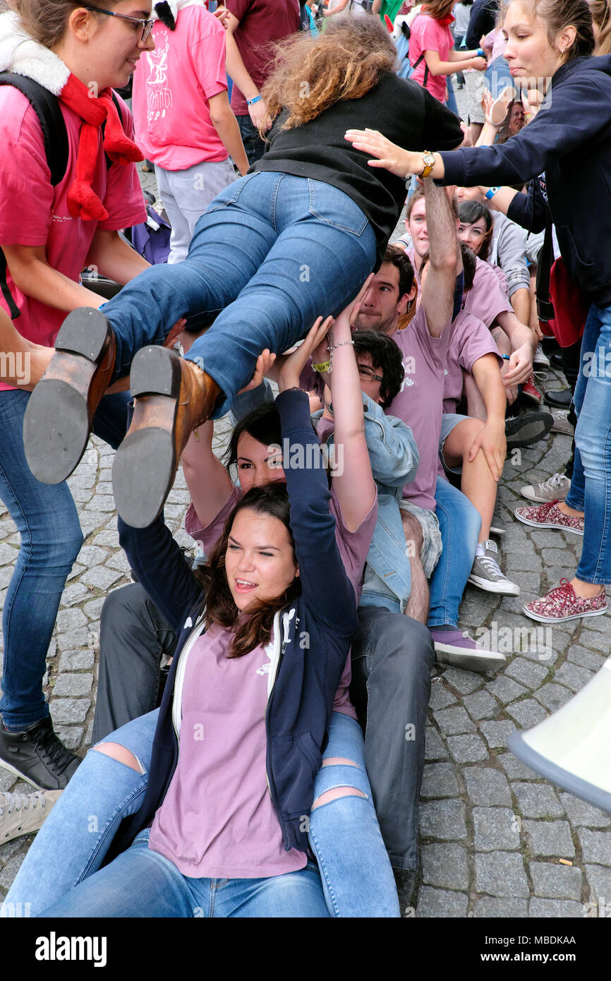 University students playing a team building game, Place de la Cathédrale, Strasbourg, Alsace, France Stock Photo