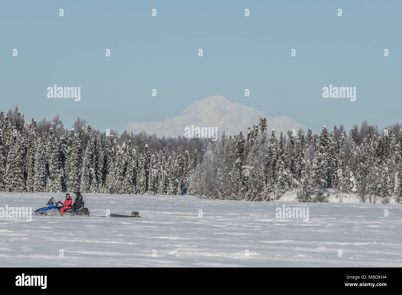 Snow machine in foreground and Denali in background at Willow Lake Stock Photo