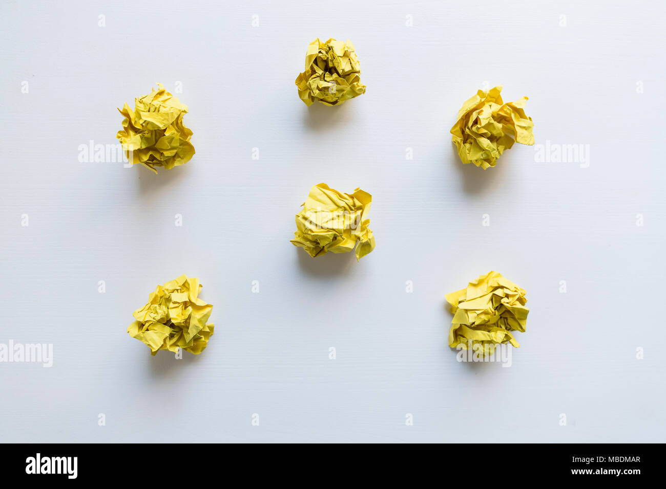 Yellow paper balls on white background. Idea Concept Stock Photo