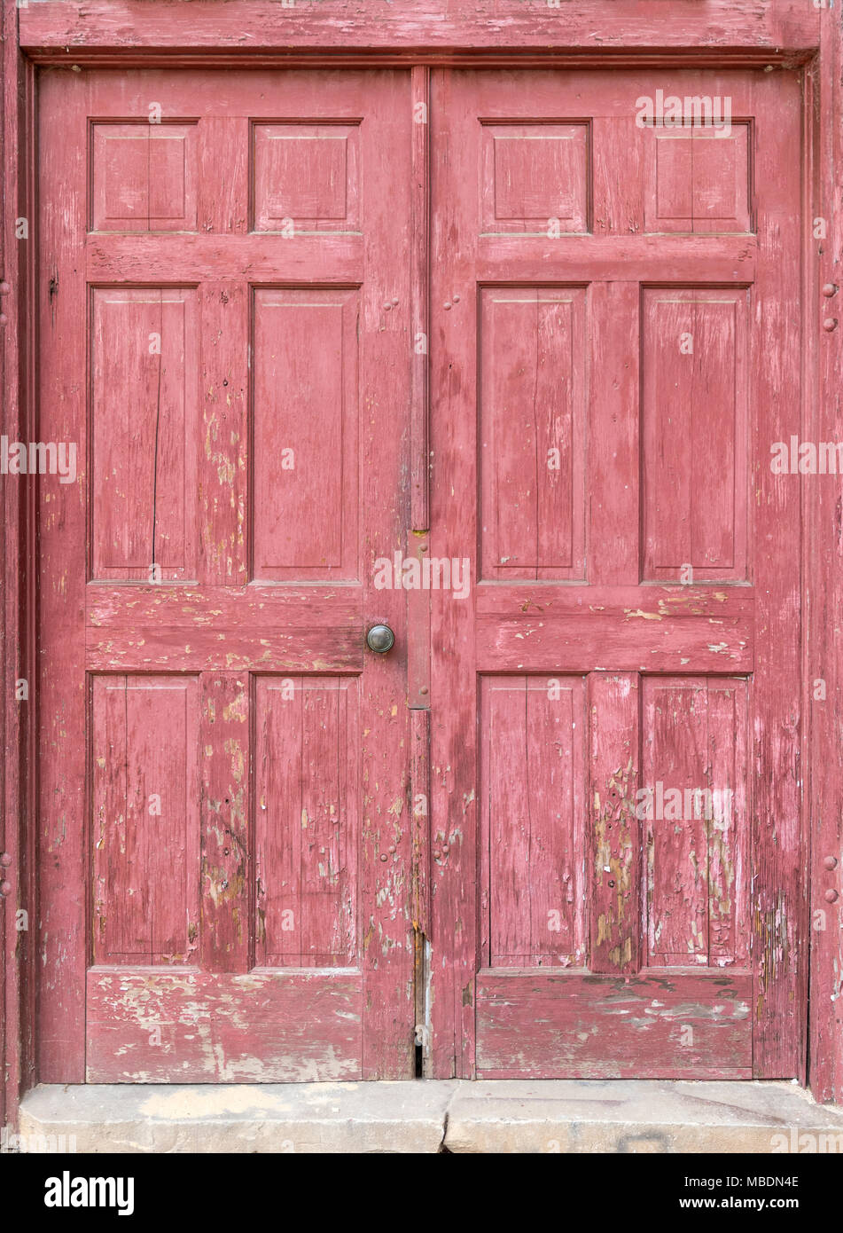 Old, Weathered, Red Painted Door for Background. Stock Photo