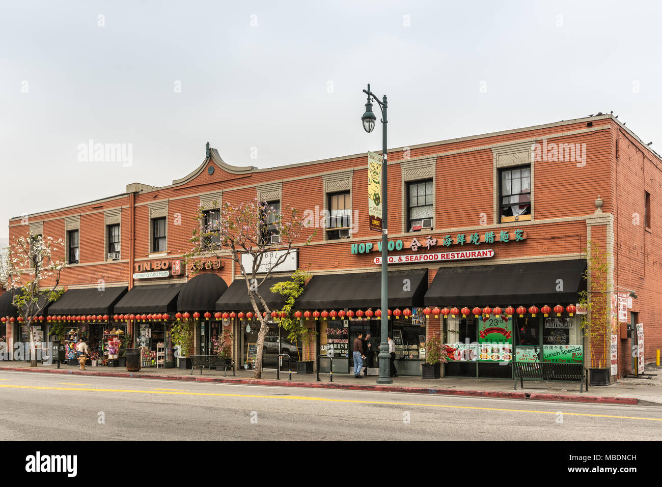 Los Angeles, CA, USA - April 5, 2018: Collection of stores and restaurants grouped in one block building of red bricks along Broadway in Chinatown und Stock Photo