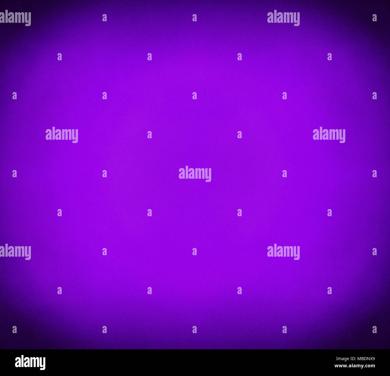 Abstract purple and violet grunge background with noise grain texture, vivid color gradient from center and dark shaded corners Stock Photo