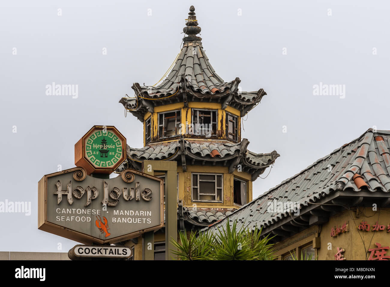 Los Angeles, CA, USA - April 5, 2018: Closeup of top of Pagoda of HopLouie bar in cental Chinatown against silver sky. Stock Photo