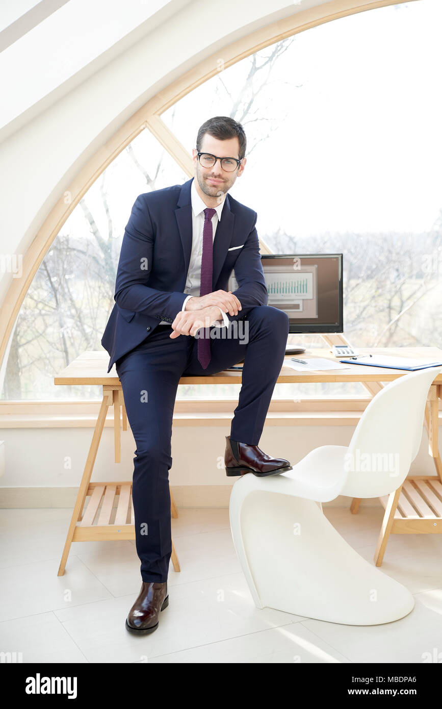 Full length shot of handsome young businessman wearing suit and looking ...