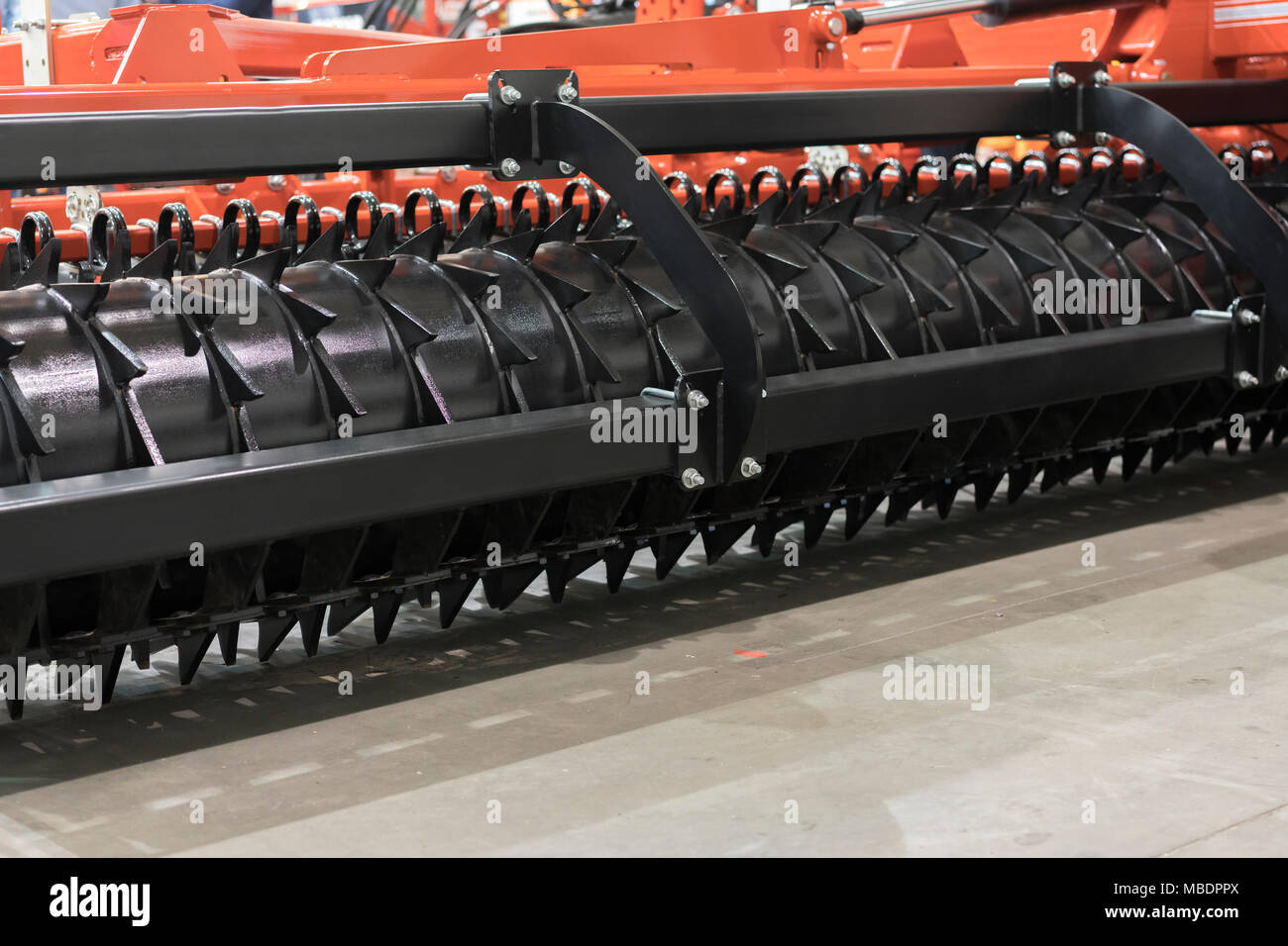Working parts of new modern agricultural disc harrow. Tillage equipment. Closeup view of
