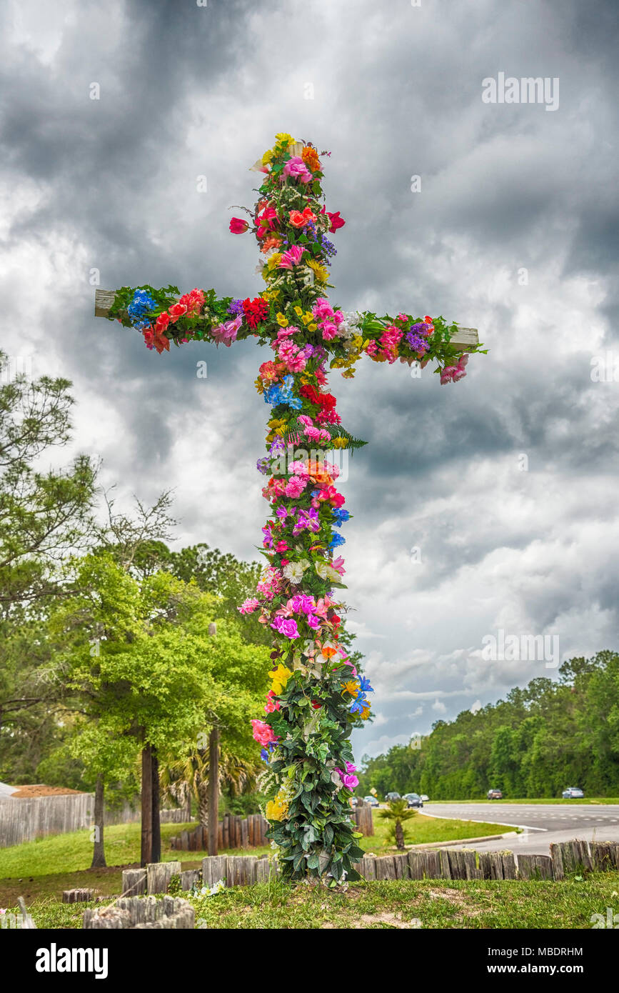 Easter Cross covered with flowers. Stock Photo