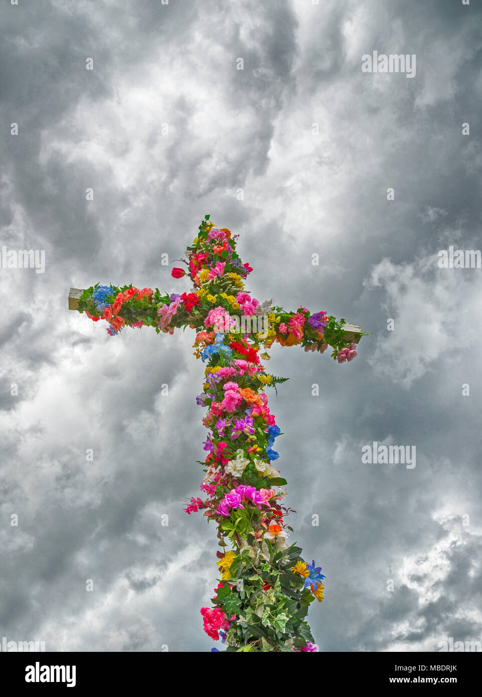 Easter Cross covered with flowers. Stock Photo