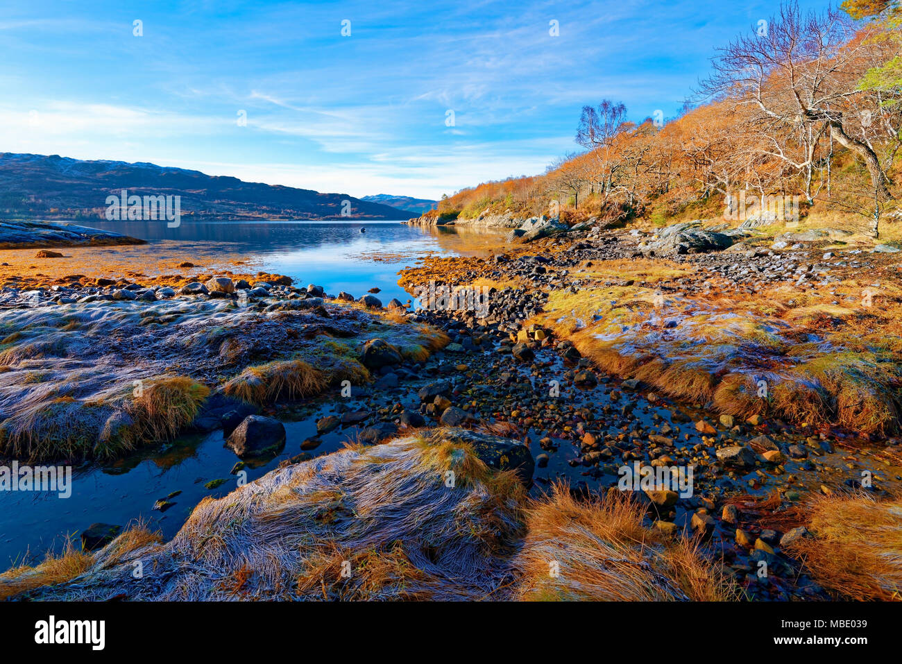 A sunny, autumn view of Loch Sunart in the Scottish Highlands as the first signs of winter appear. Stock Photo
