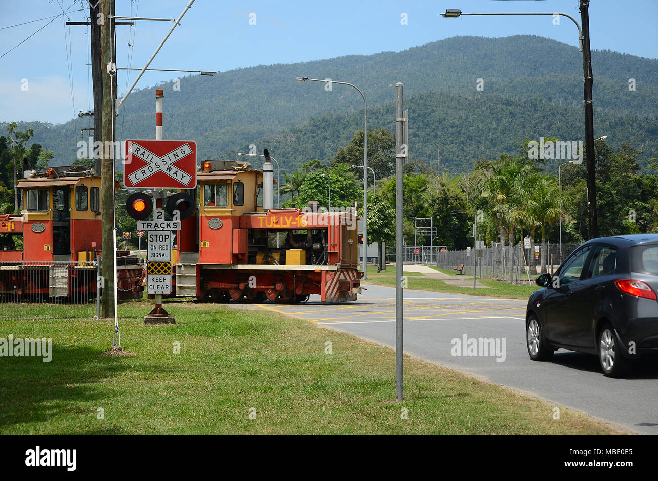 industrial sugar cane cargo locomotive crossing road Stock Photo