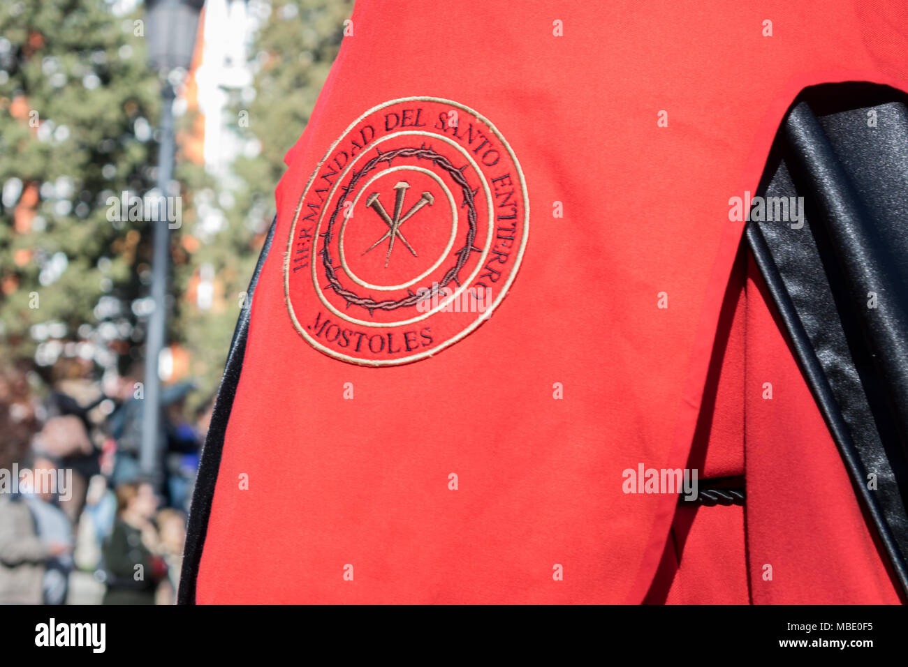 Close up of symbology on a penitent's robe in an Easter parade on Holy ...