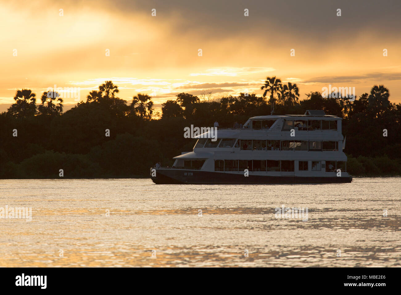 Boat during a sunset cruise on the Zambezi River near Victoria Falls in