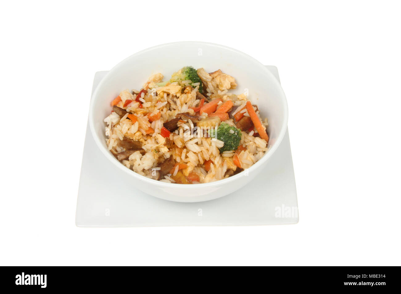 Stir ried rice in a bowl on a square plate isolated  against white Stock Photo