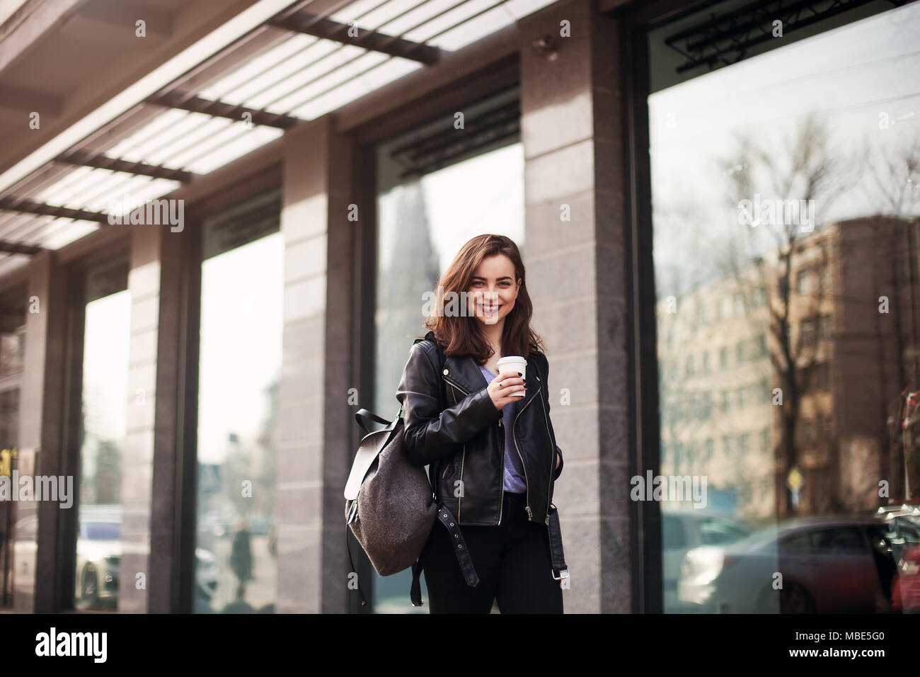 Close up fashion street style portrait of a beautiful girl in a casual ...