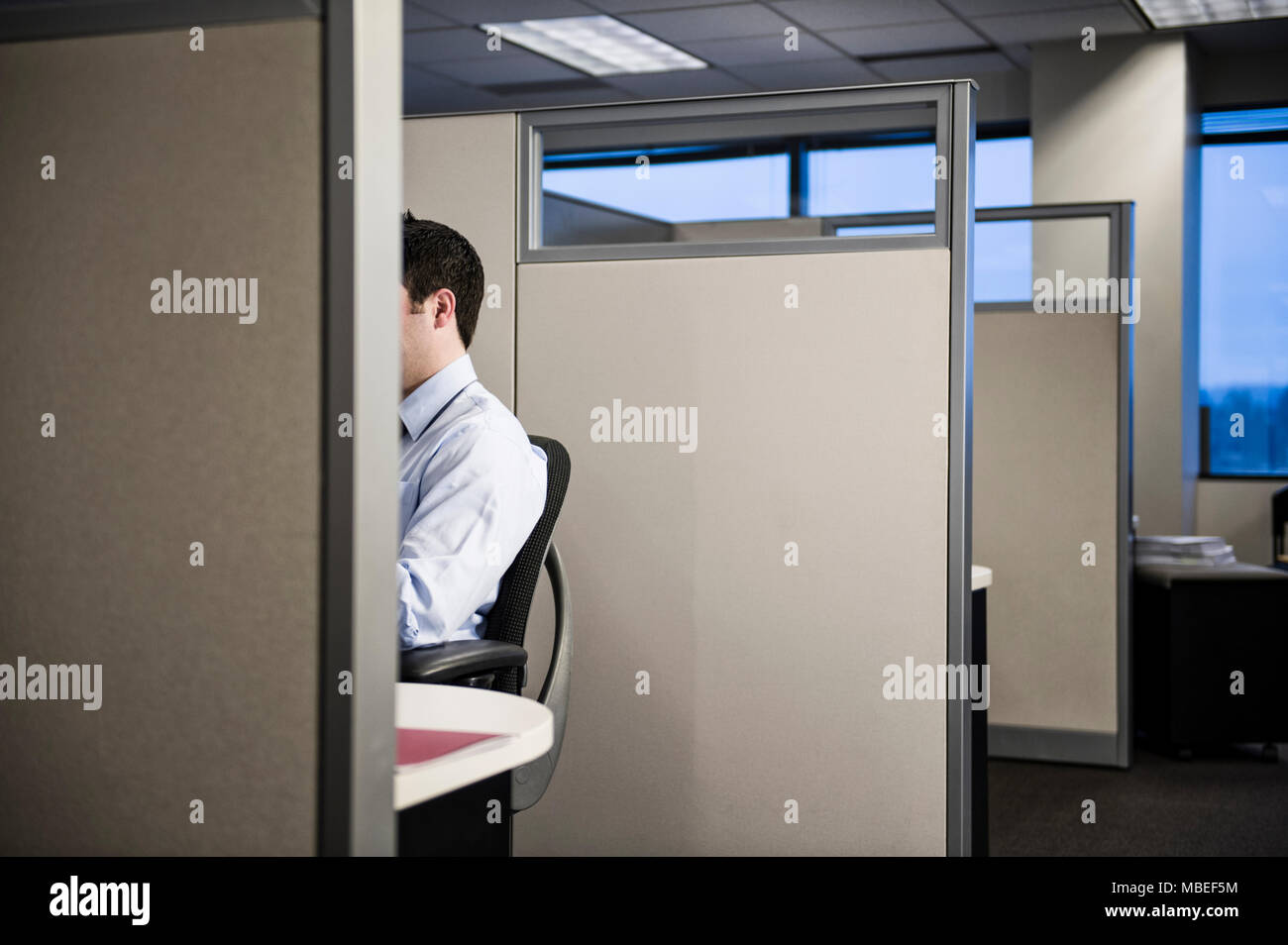 Caucasian businessman working in cubicle office Stock Photo - Alamy