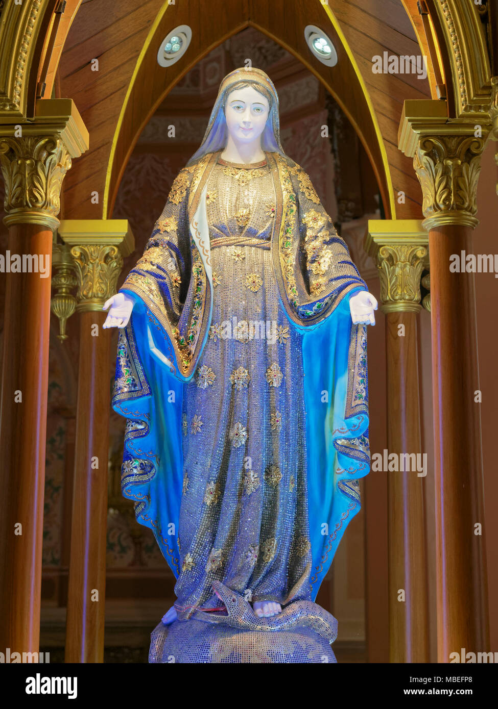 Blessed Virgin Mary, mother of Jesus, sculpture under an arch with ...