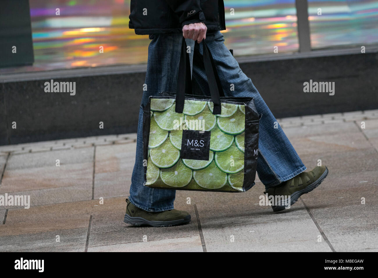 M&S spring sales with shoppers carrying reusable bags in Preston city ...