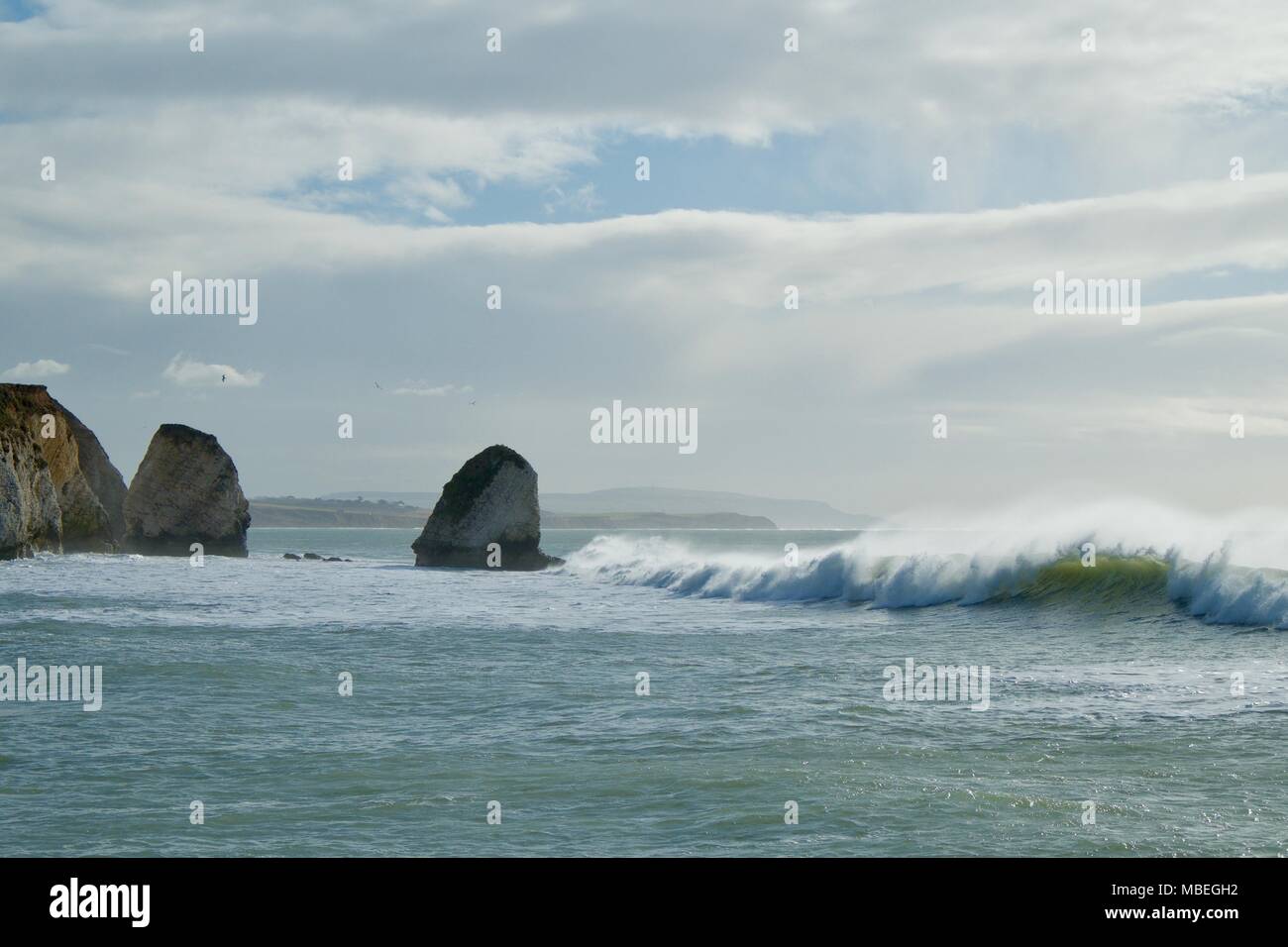 Surf is up at Freshwater Bay, Isle of Wight with large wave Stock Photo