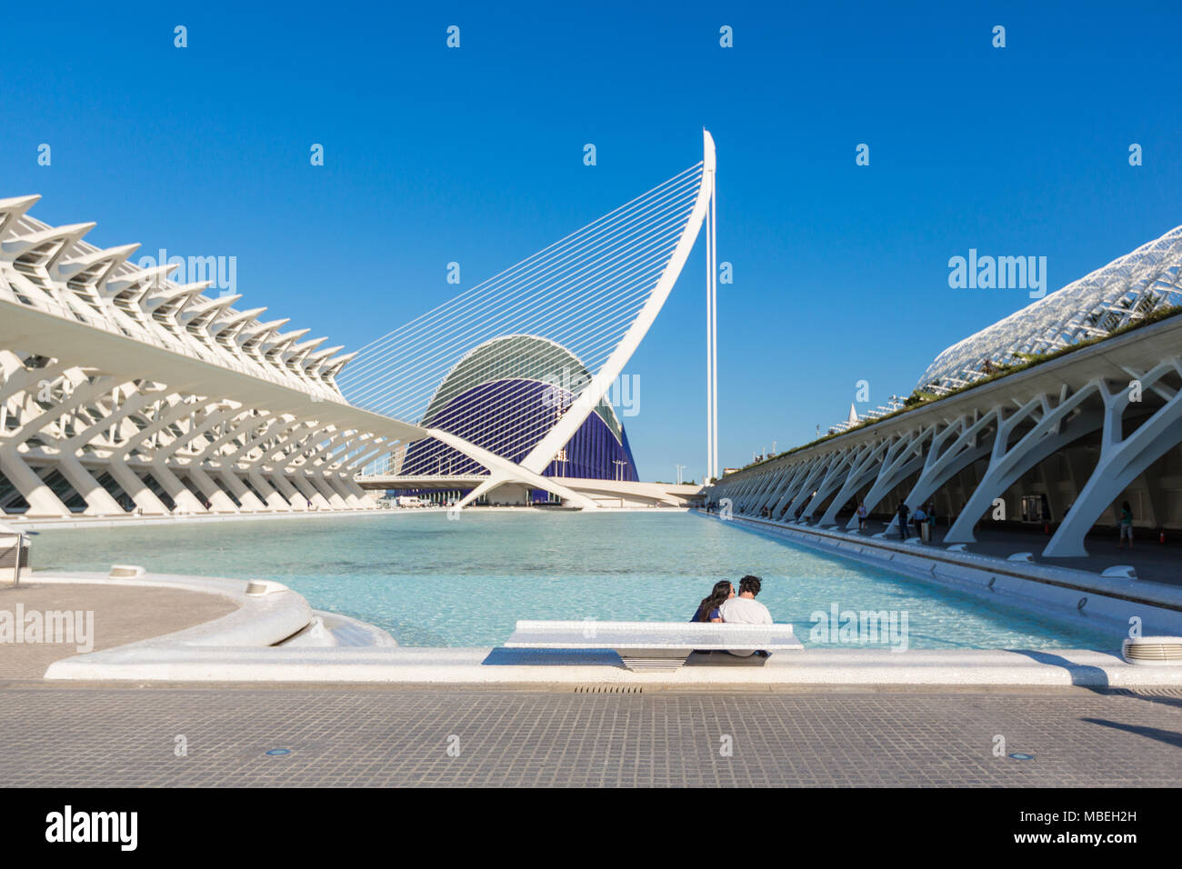 VALENCIA, SPAIN - JUNE 18, 2015: Young couple relaxes at the pool with a view on Oceanografic in The city of arts and sciencies in Valencia, Spain Stock Photo