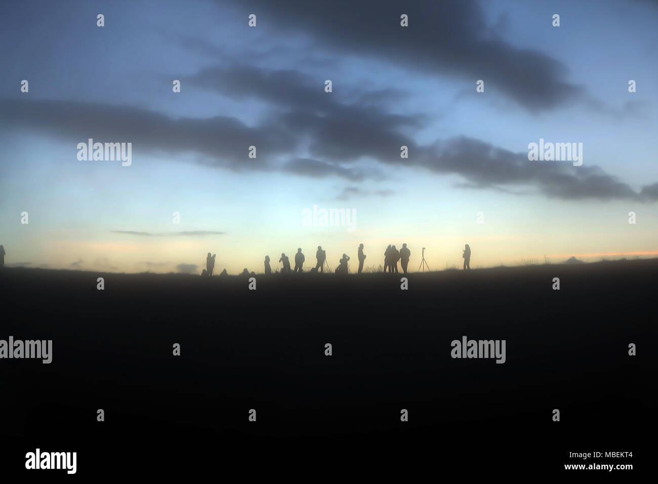 Silhouette of the man success on the peak of mountain and photographer ...