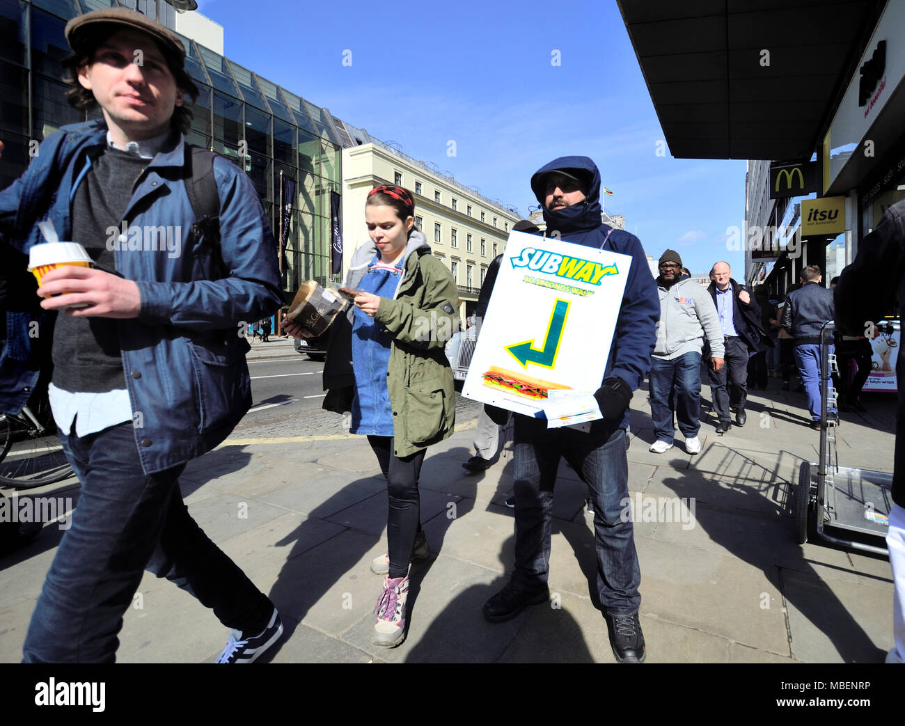 London, England, UK. Man ijn Oxford Street holding advertising for Subway sandwich shop Stock Photo