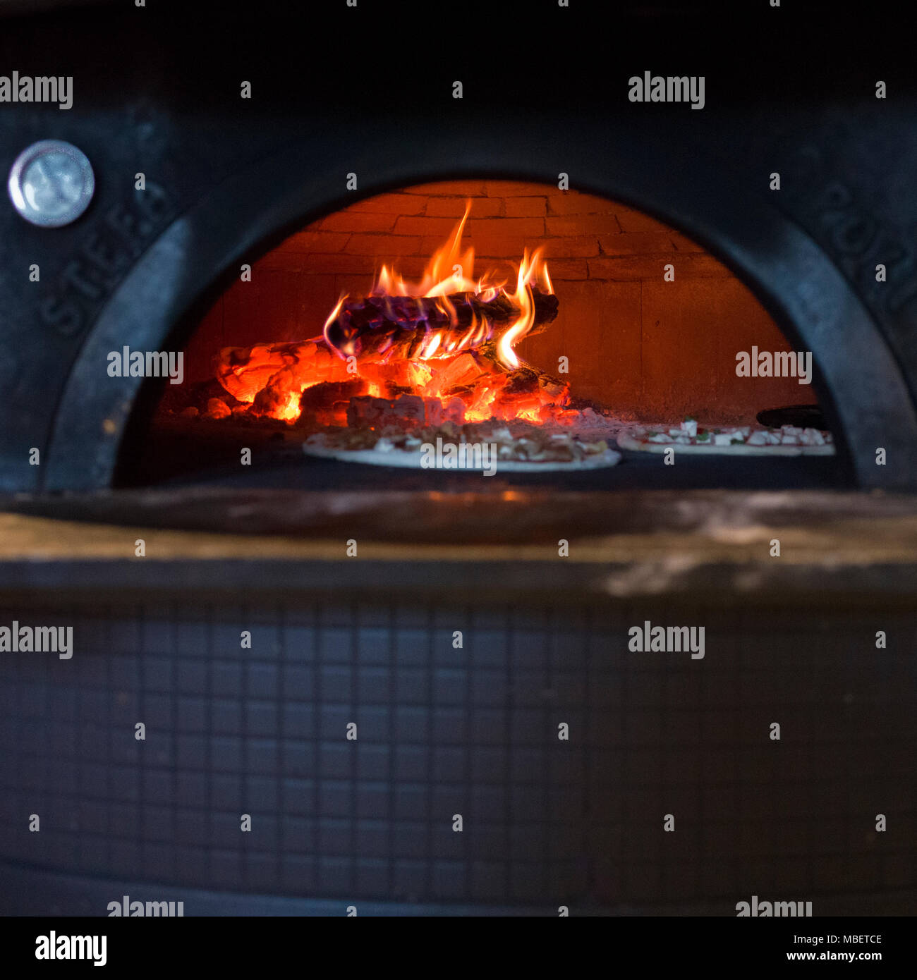 Pizza being baked in traditional oven, Stonefire Pizzeria, Kimberley, British Columbia, Canada Stock Photo