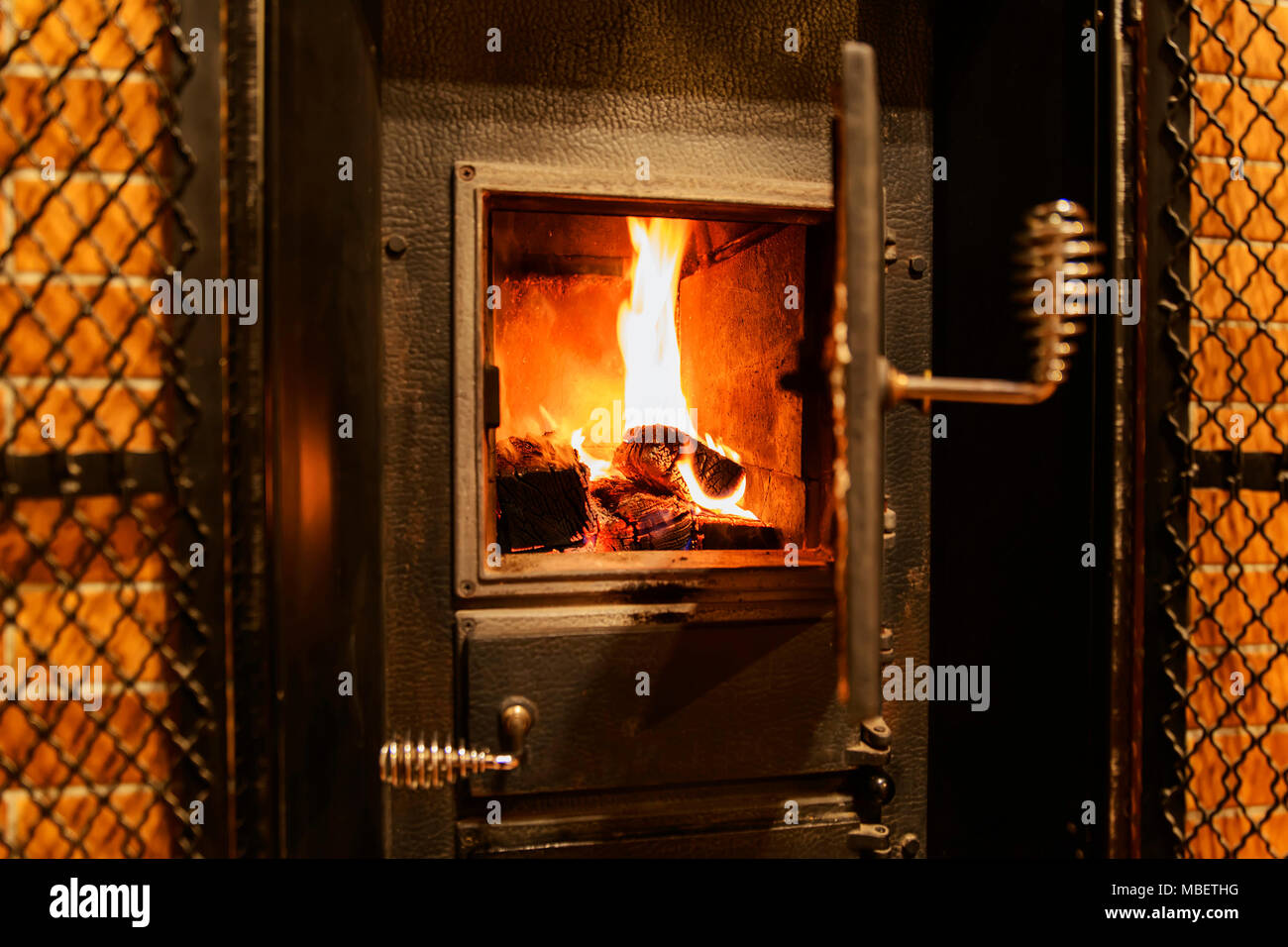 Redyellow flames in the furnace of the old furnace Stock Photo Alamy