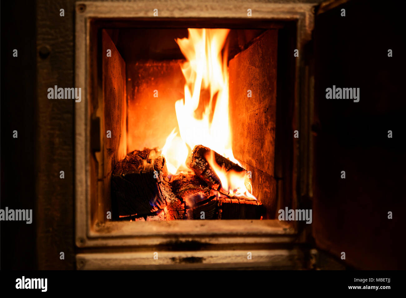 Redyellow flames in the furnace of the old furnace Stock Photo Alamy